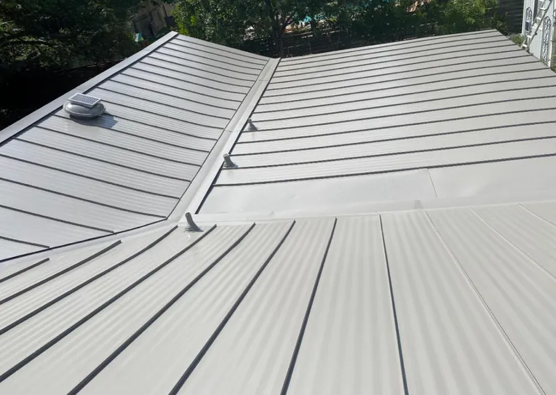 Solar attic fan installed on a metal roof for Roof Ventilation in Sault Ste. Marie